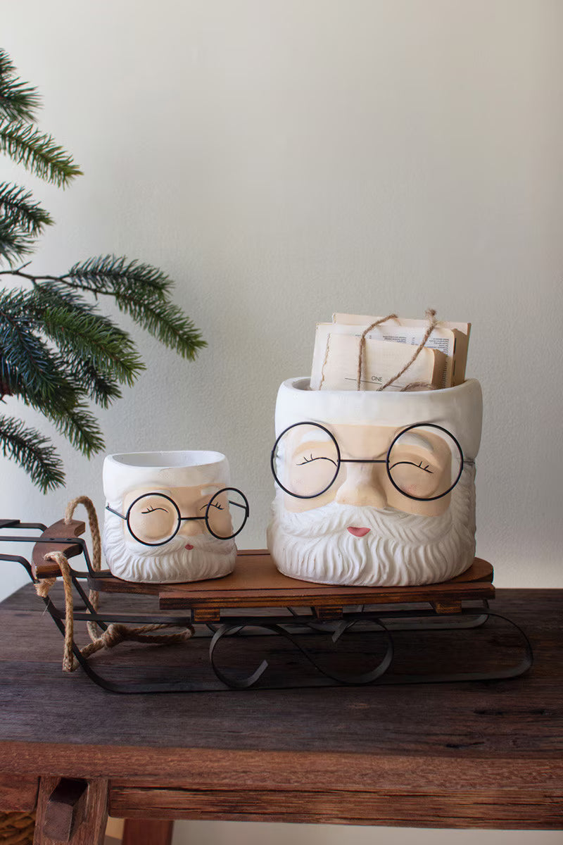 SET OF TWO CONCRETE SANTA PLANTERS