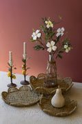 SET OF THREE FLOWER SHAPED WOVEN SEAGRASS TRAYS