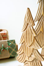 SET OF THREE CARVED WOODEN CHRISTMAS TREES ON BASES