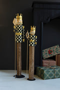 SET OF TWO PAINTED METAL AND WOOD CHECKERBOARD NUTCRACKERS