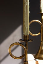 SET OF THREE ANTIQUE BRASS TRUMPET TAPER CANDLE HOLDERS