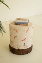 Cream Upholstered Ottoman with Embroidered Detail and Carved Wood Base