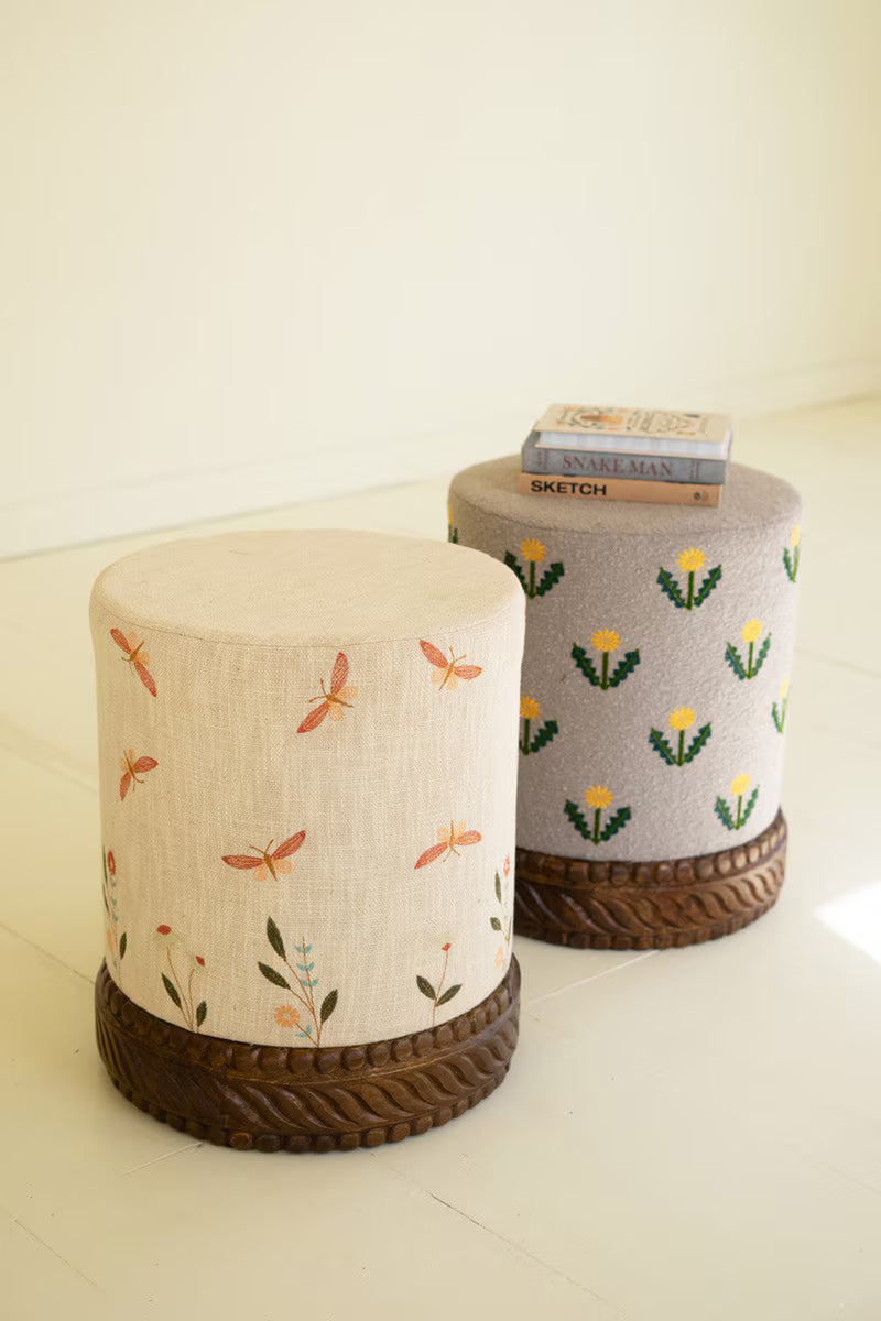 Cream Upholstered Ottoman with Embroidered Detail and Carved Wood Base